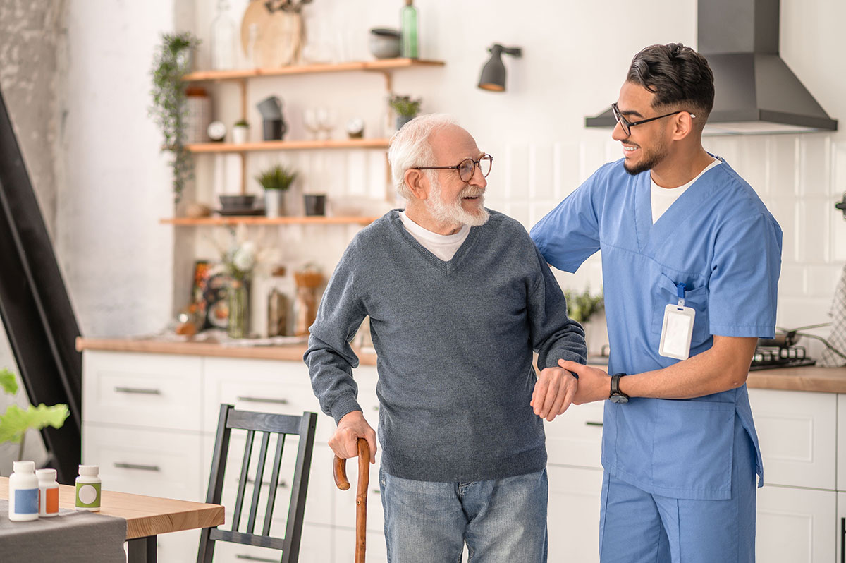Aged care professional helping participant